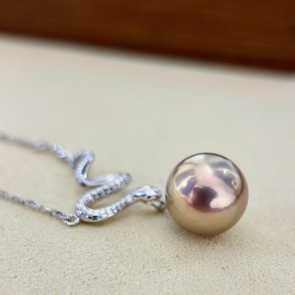 Multicolor freshwater pearl pendant with green, red and golden tones.