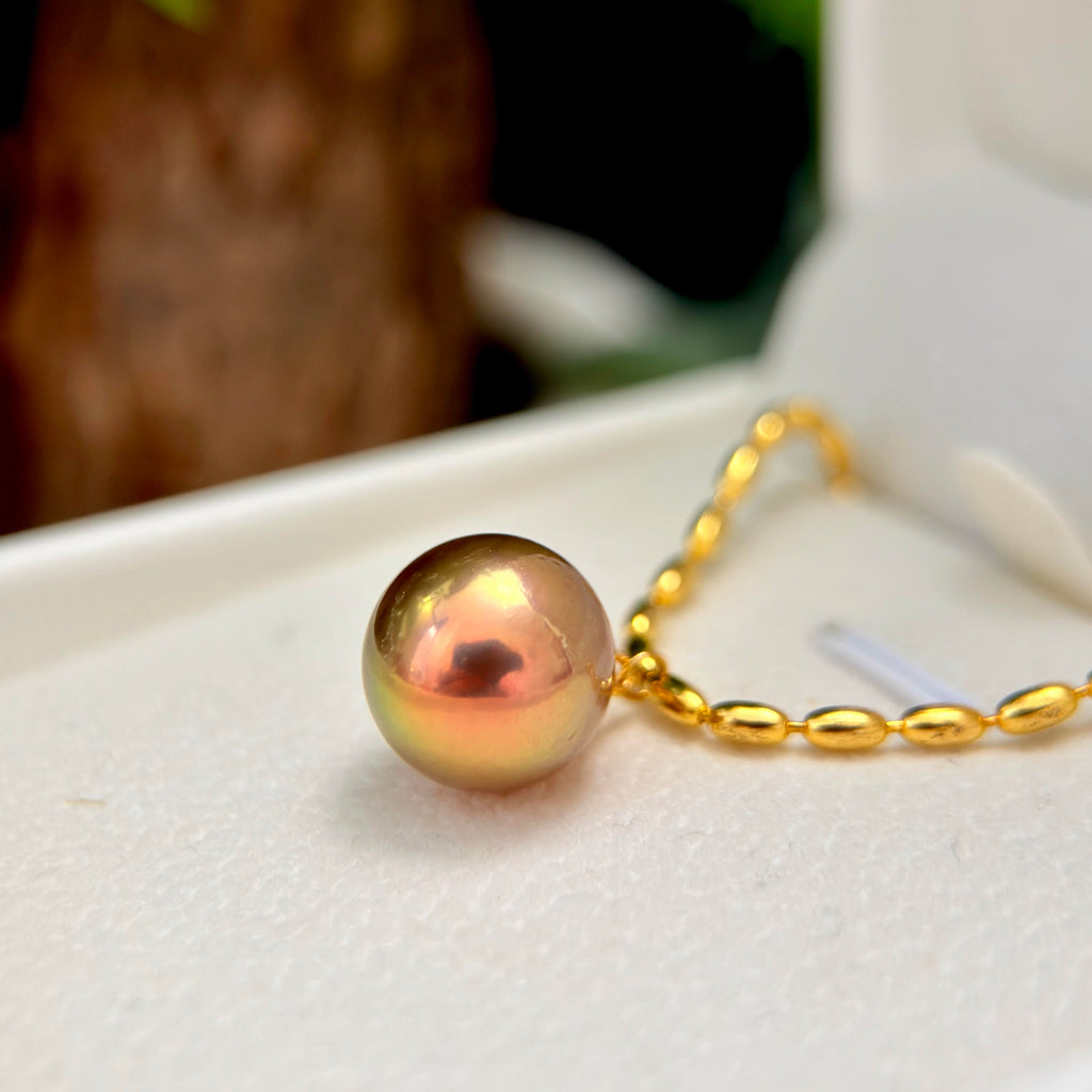 12 mm iridescent freshwater pearl necklace with green, golden and brown tones.