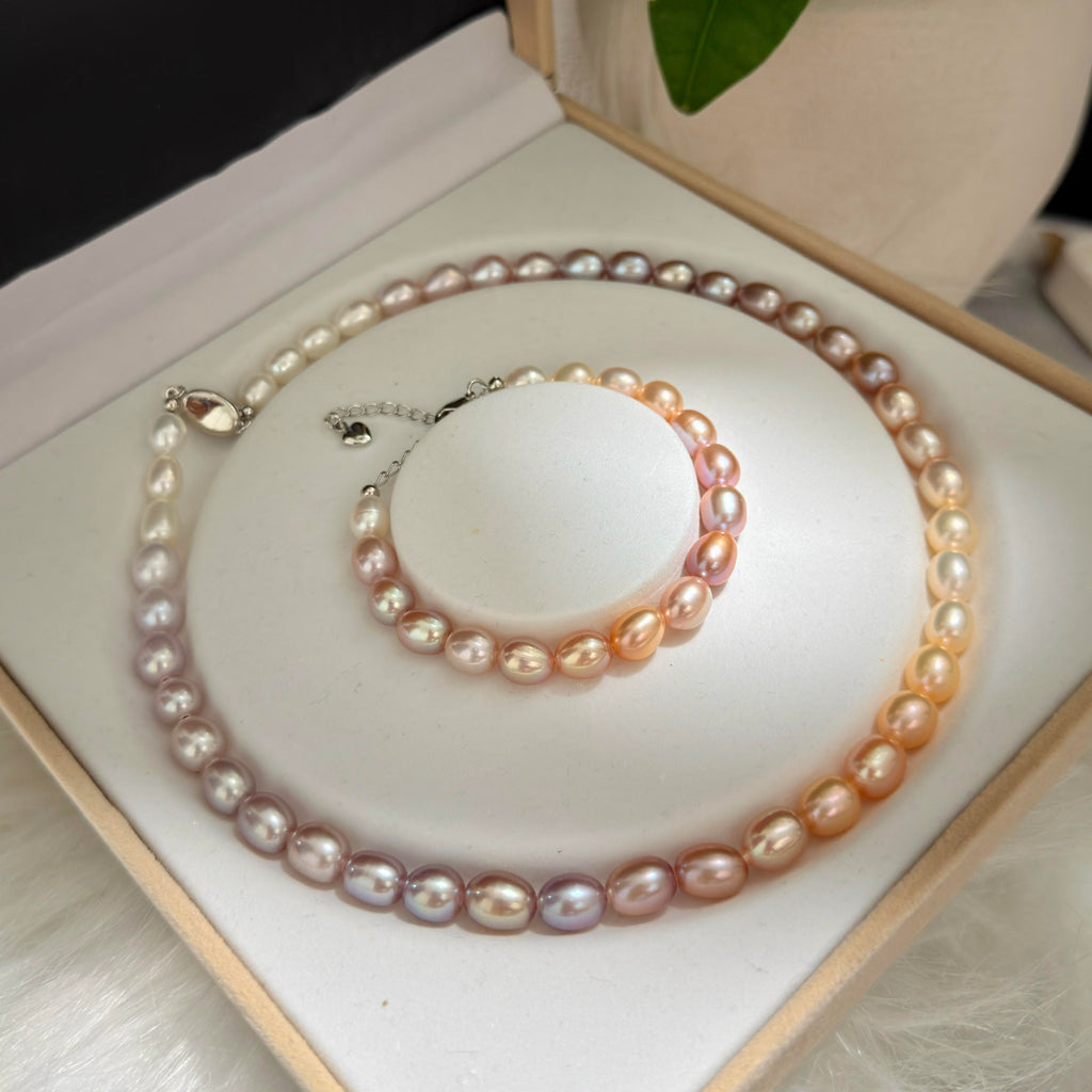 Undyed natural freshwater pearl set with soft organic multicolor variation.
