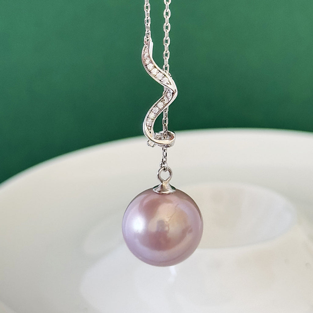 14.5 mm natural pearl pendant on an adjustable sterling silver chain.