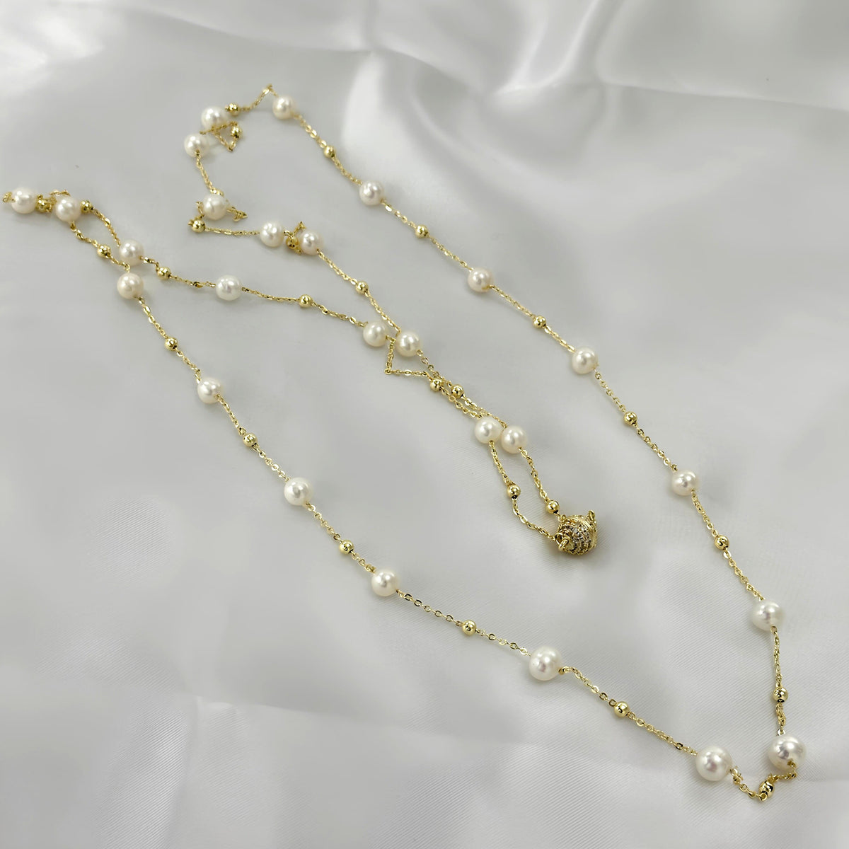 Natural white pearls paired with a delicate gold-tone chain.