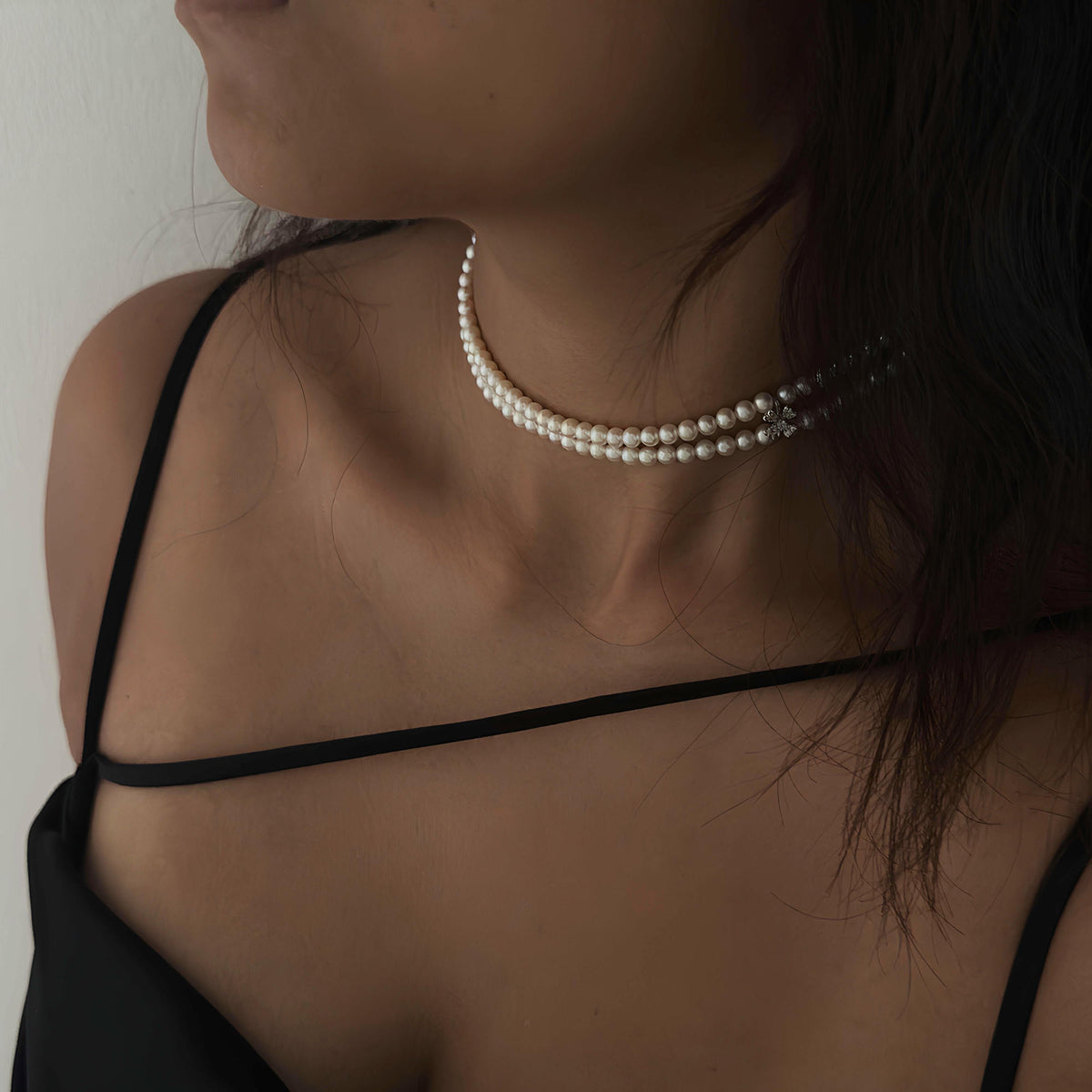 Natural freshwater pearls arranged in an elegant double-strand necklace.