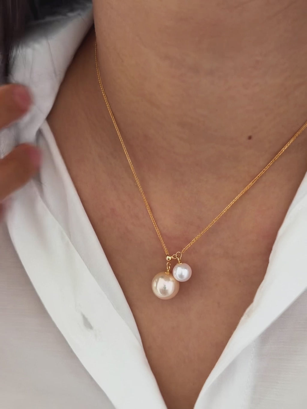 Golden and white double pearl necklace styled for an elegant dinner look.