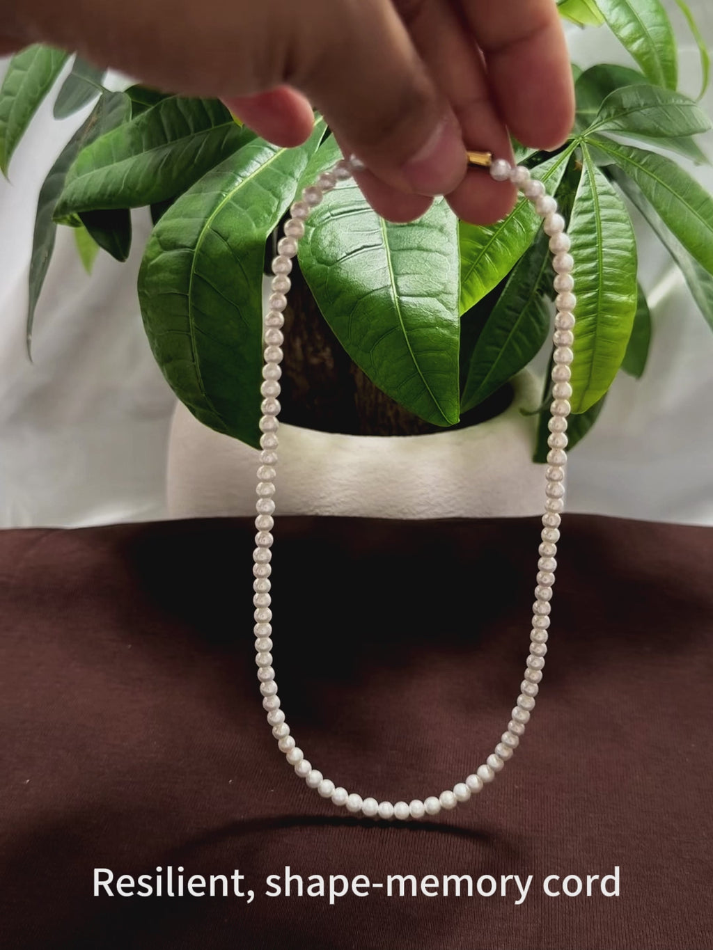 Strung on a resilient, shape-memory cord that springs back to its original form, resists deformation, and prevents tangling.