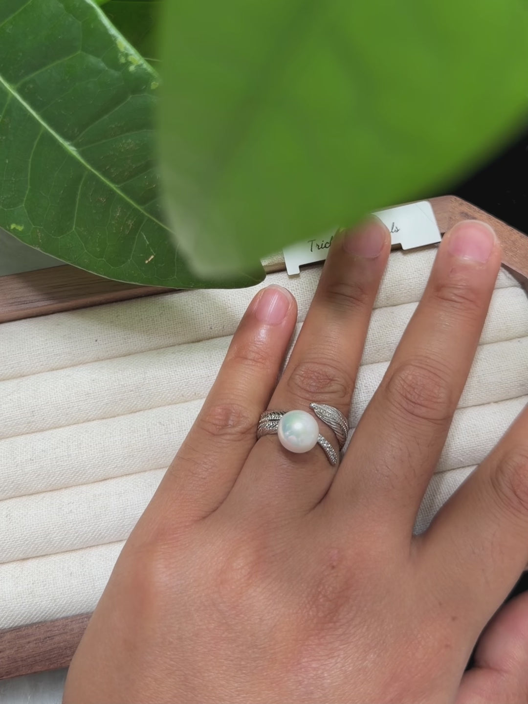 White pearl ring with adjustable open sterling silver band.