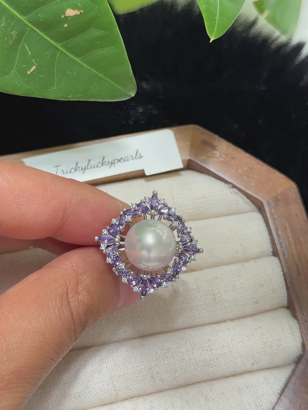 Natural white pearl ring with purple and clear sparkling stones.