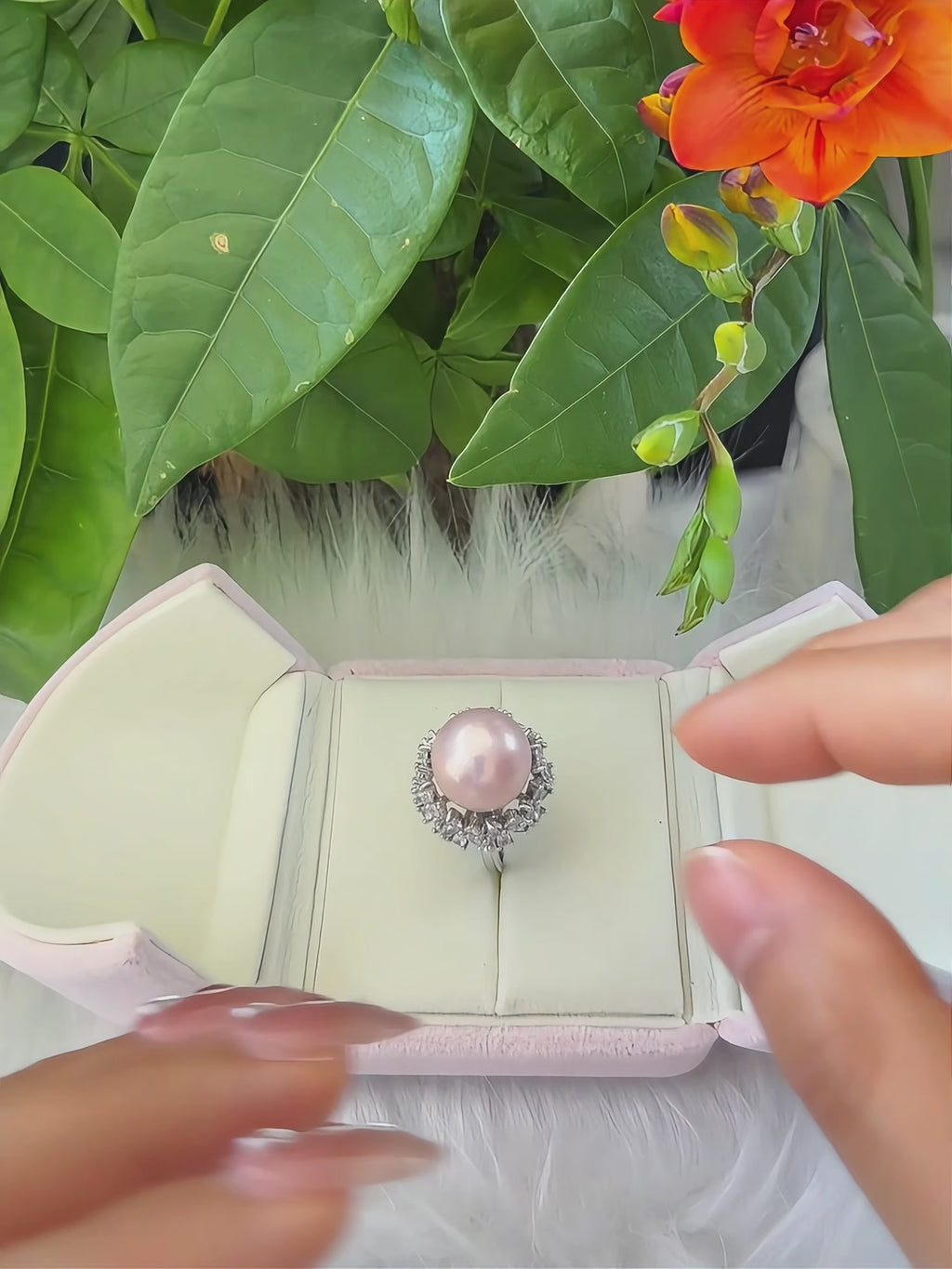 Soft pink freshwater pearl statement ring with floral design.