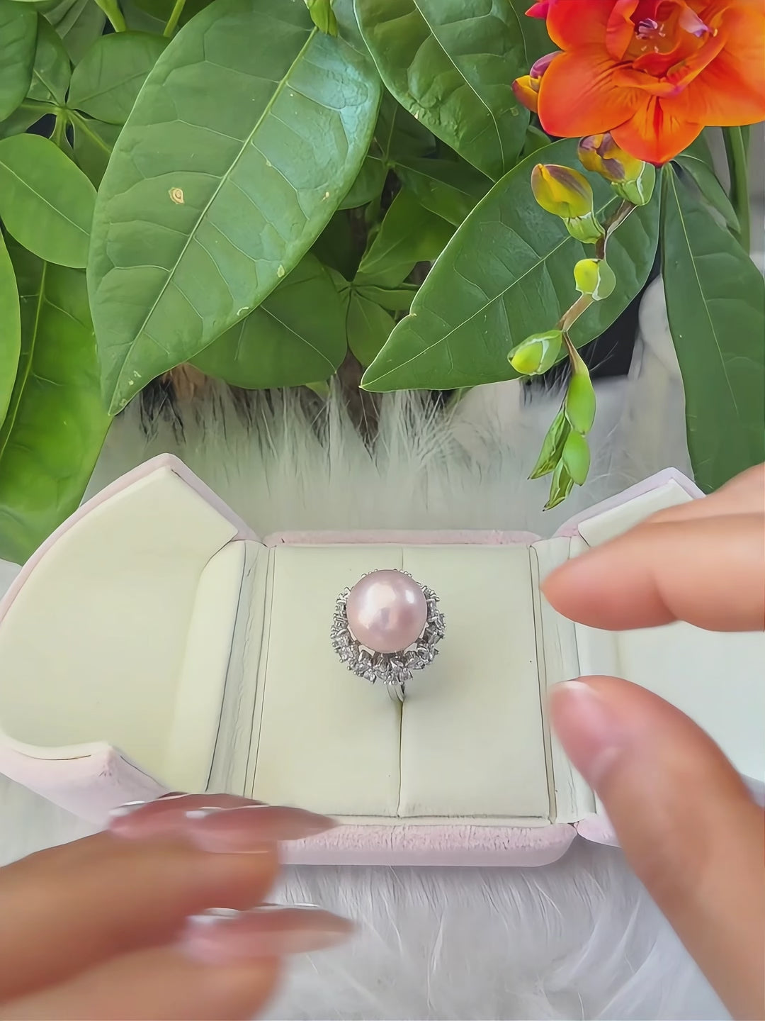Soft pink freshwater pearl statement ring with floral design.