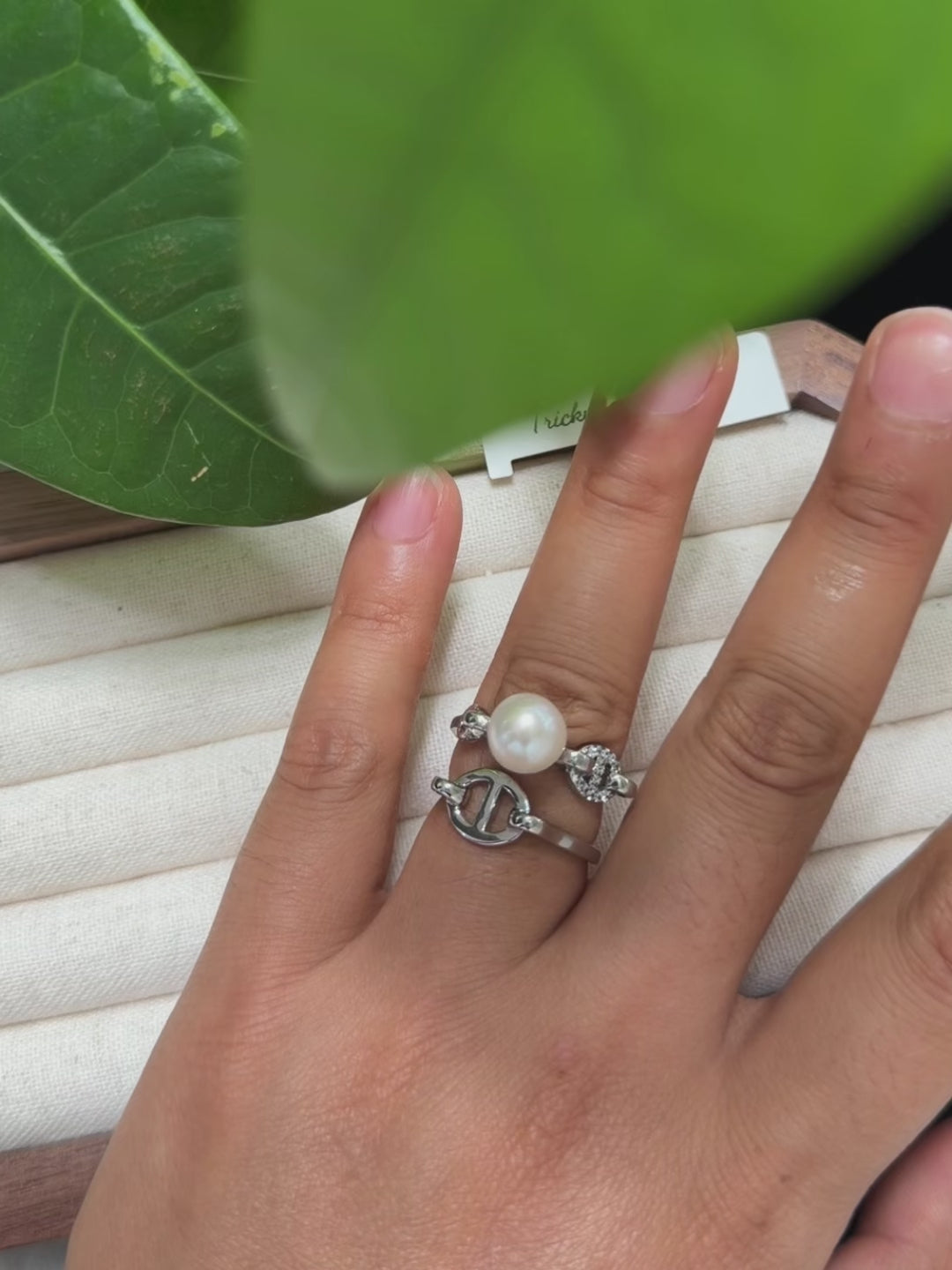 Sculptural sterling silver ring with natural freshwater pearl. Cool modern white pearl ring with polished silver details.