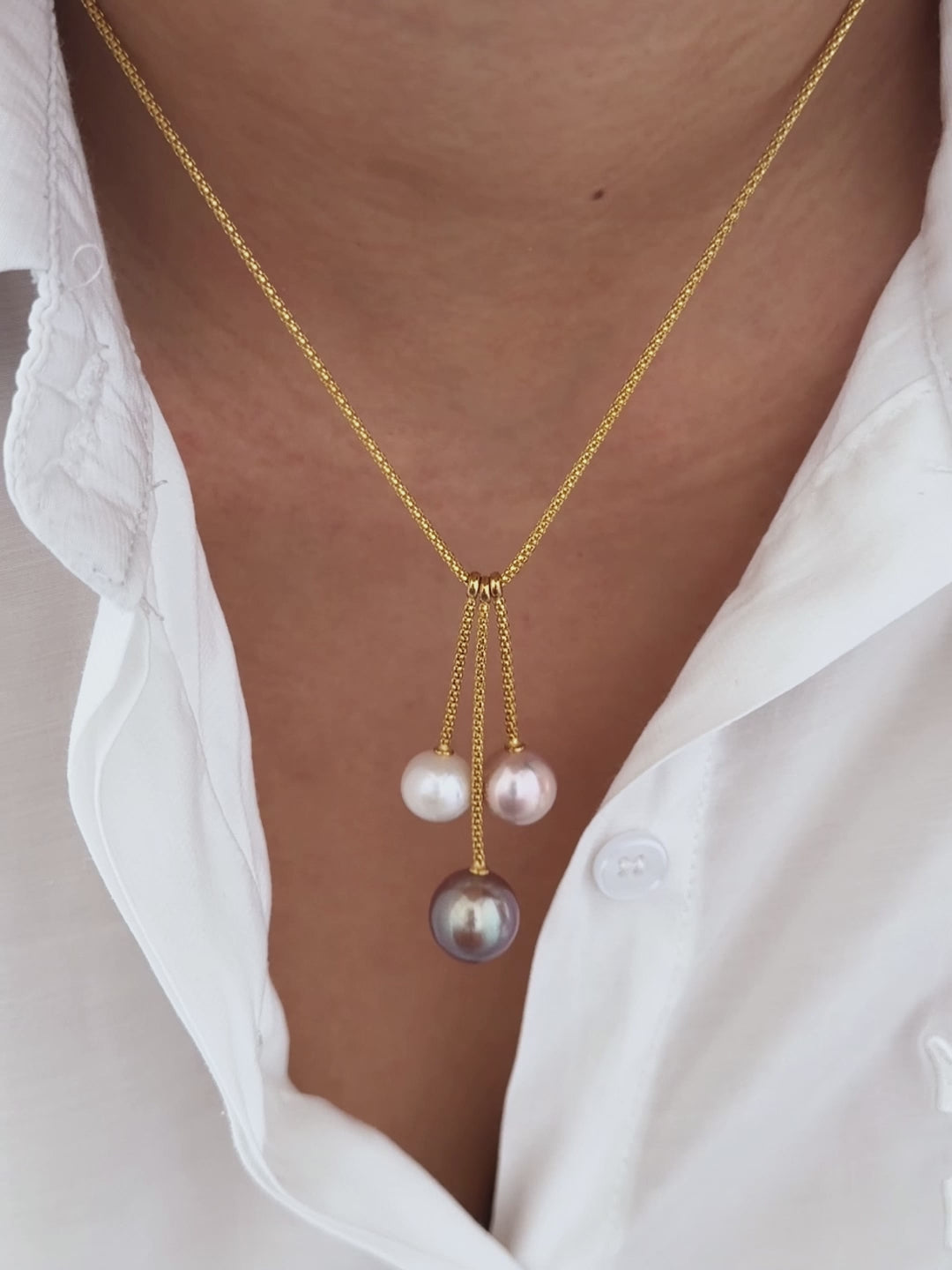 Purple, pink and white pearl necklace styled for an elegant dinner look.