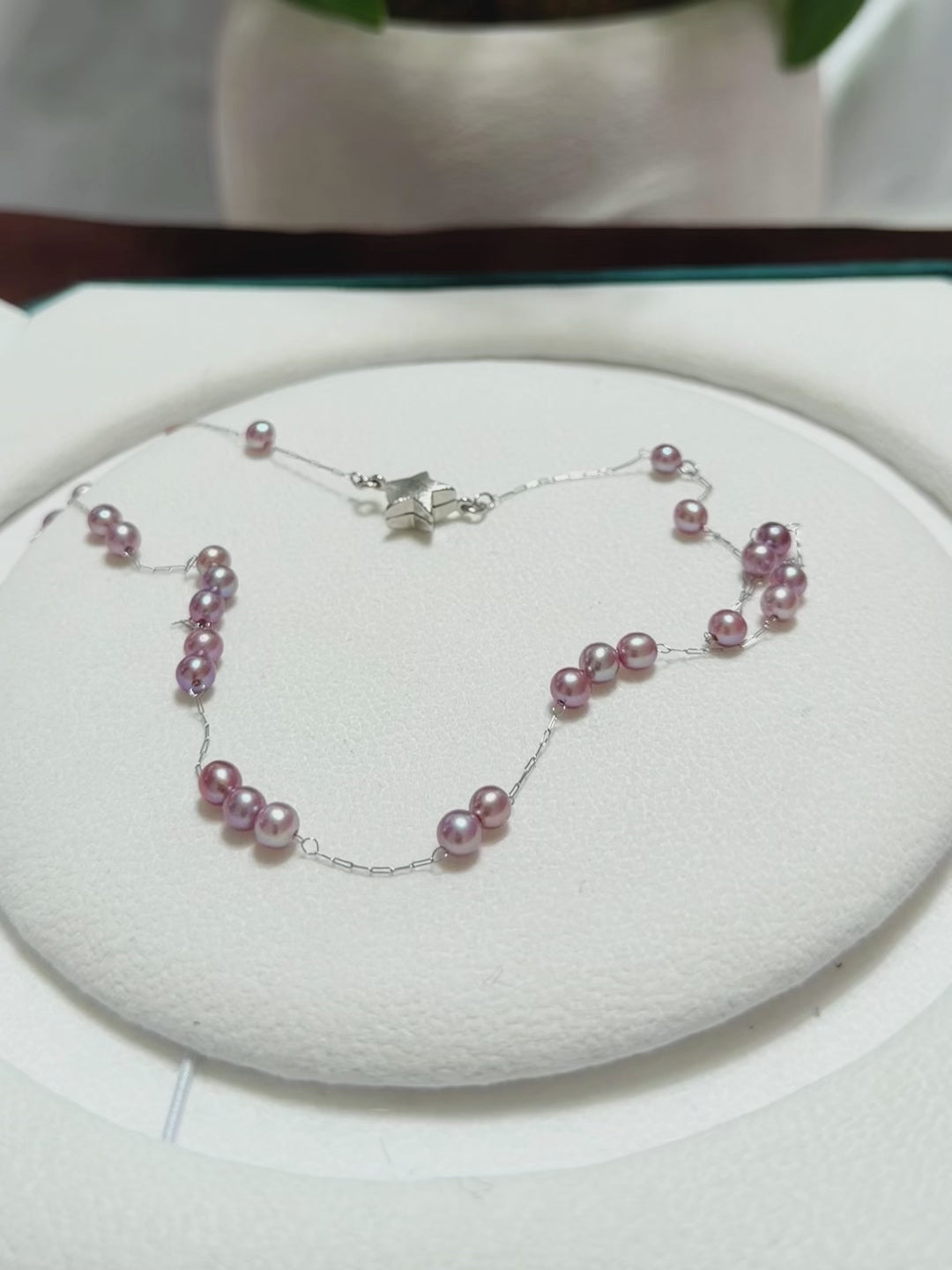 Detailed view of bright natural lustre on the freshwater pearls.