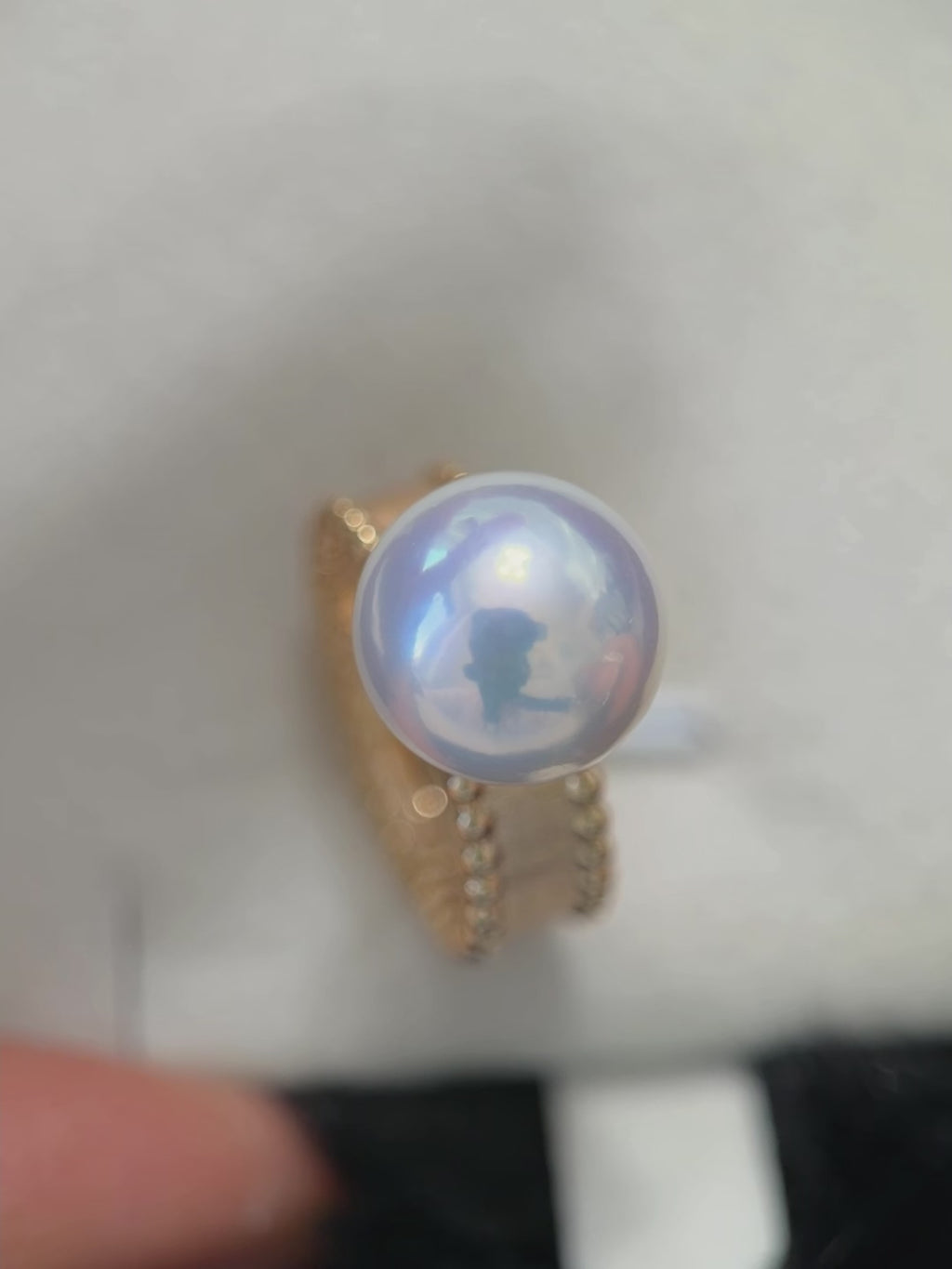 Luxury freshwater pearl ring with warm gold-plated setting.