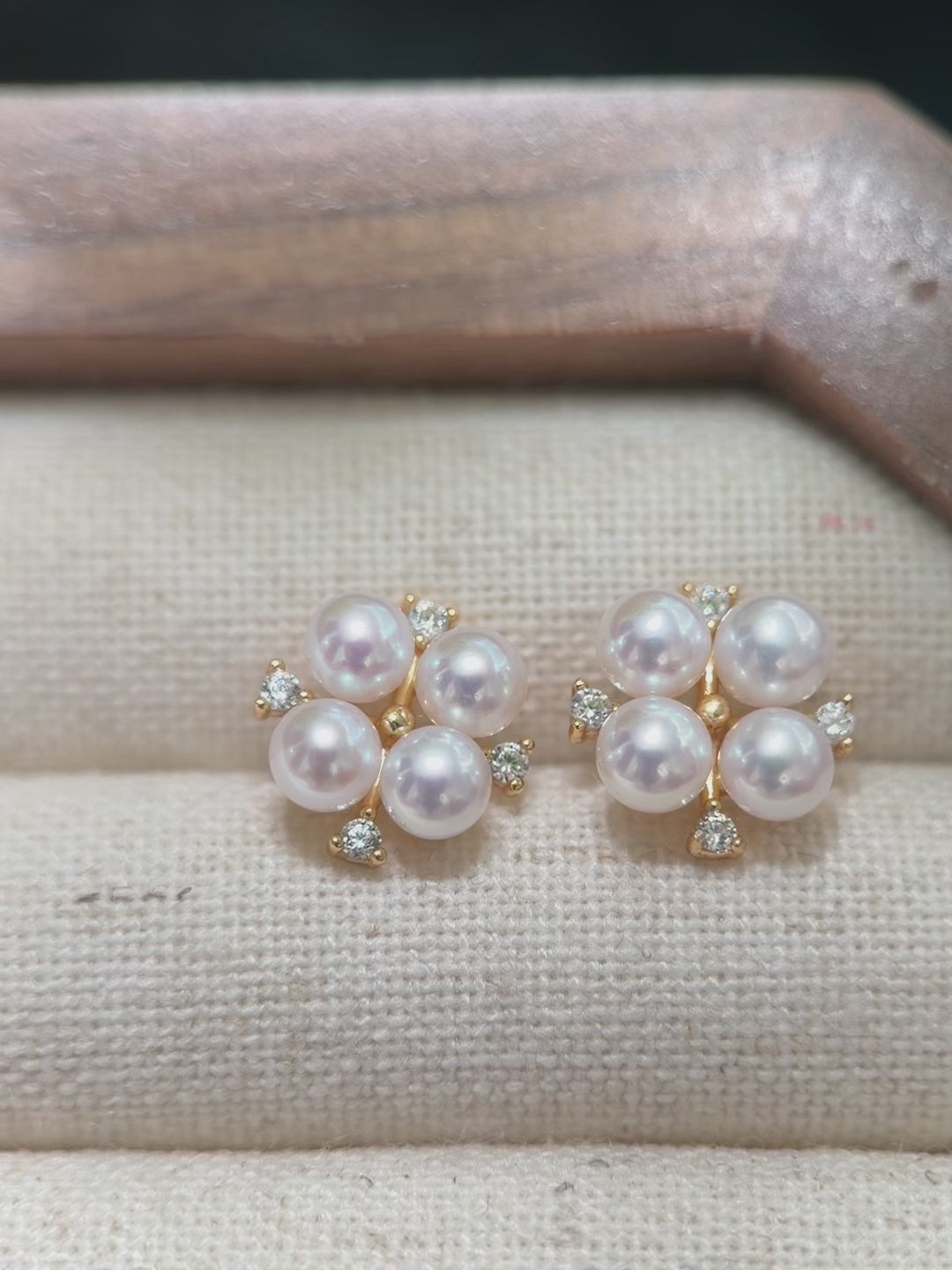 Romantic floral stud earrings featuring 4 mm freshwater pearls with a pink halo.