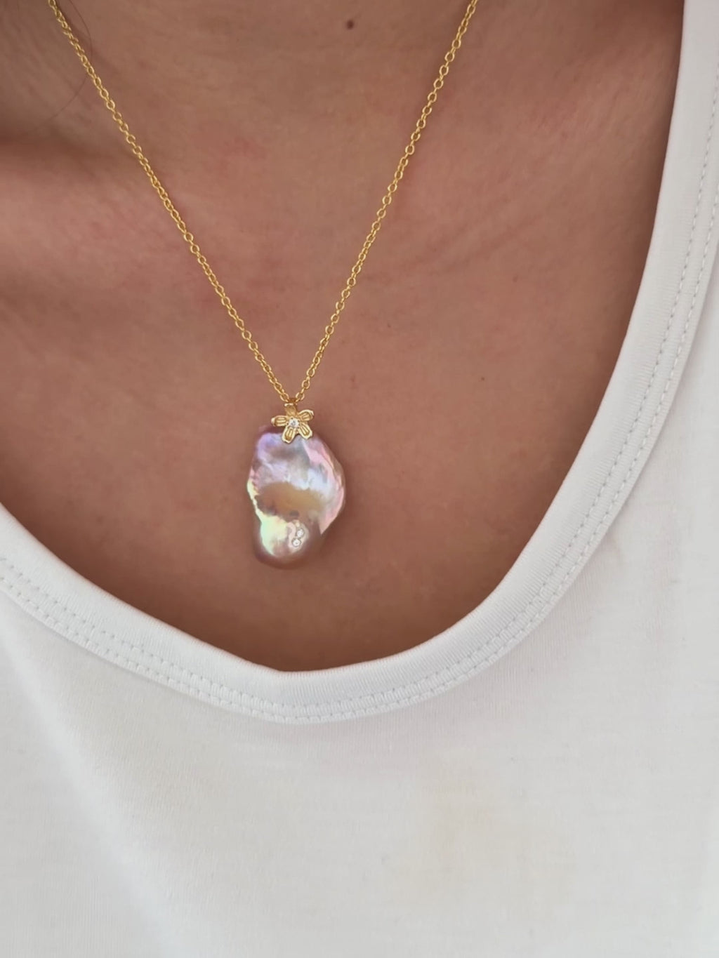 Freshwater pearl jewelry featuring golden-green baroque pearl pendant with sculptural osmanthus flower in sterling silver.