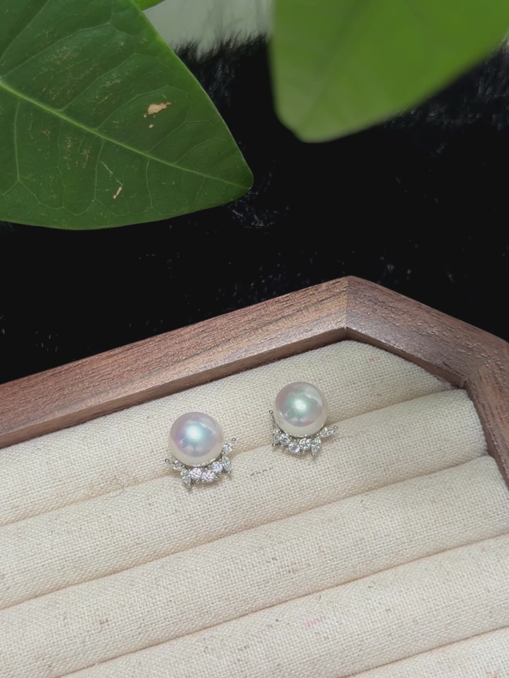 White freshwater pearl earrings with refined silver decorative accents.