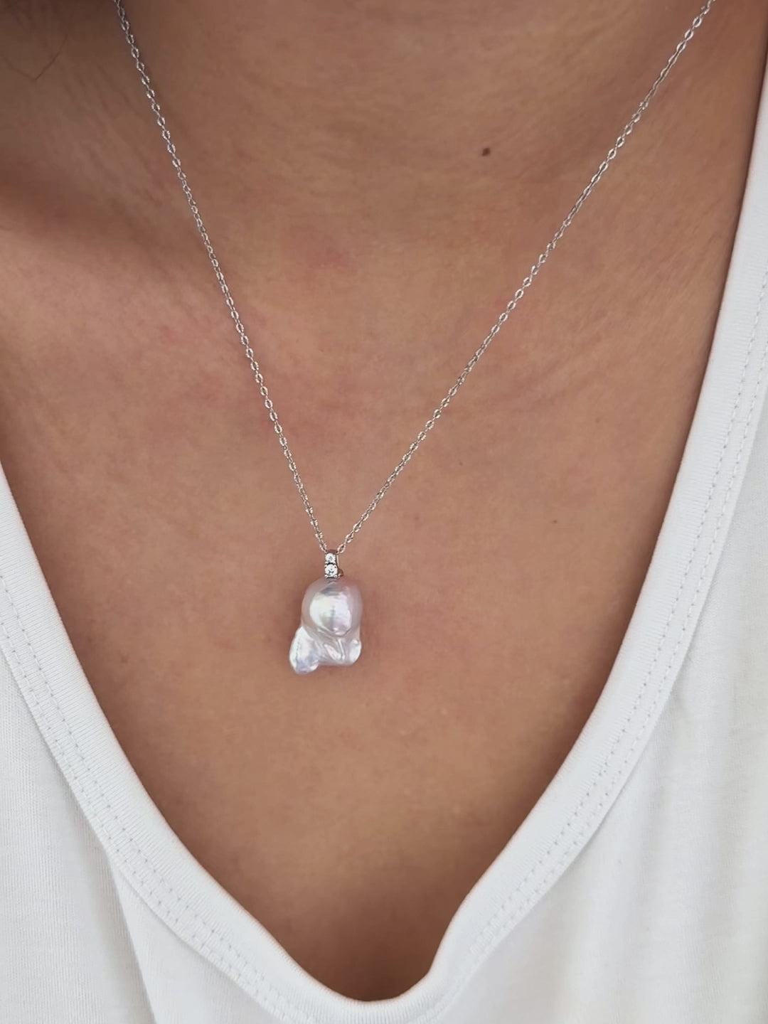 19 mm freshwater baroque pearl pendant with bright natural lustre on model.