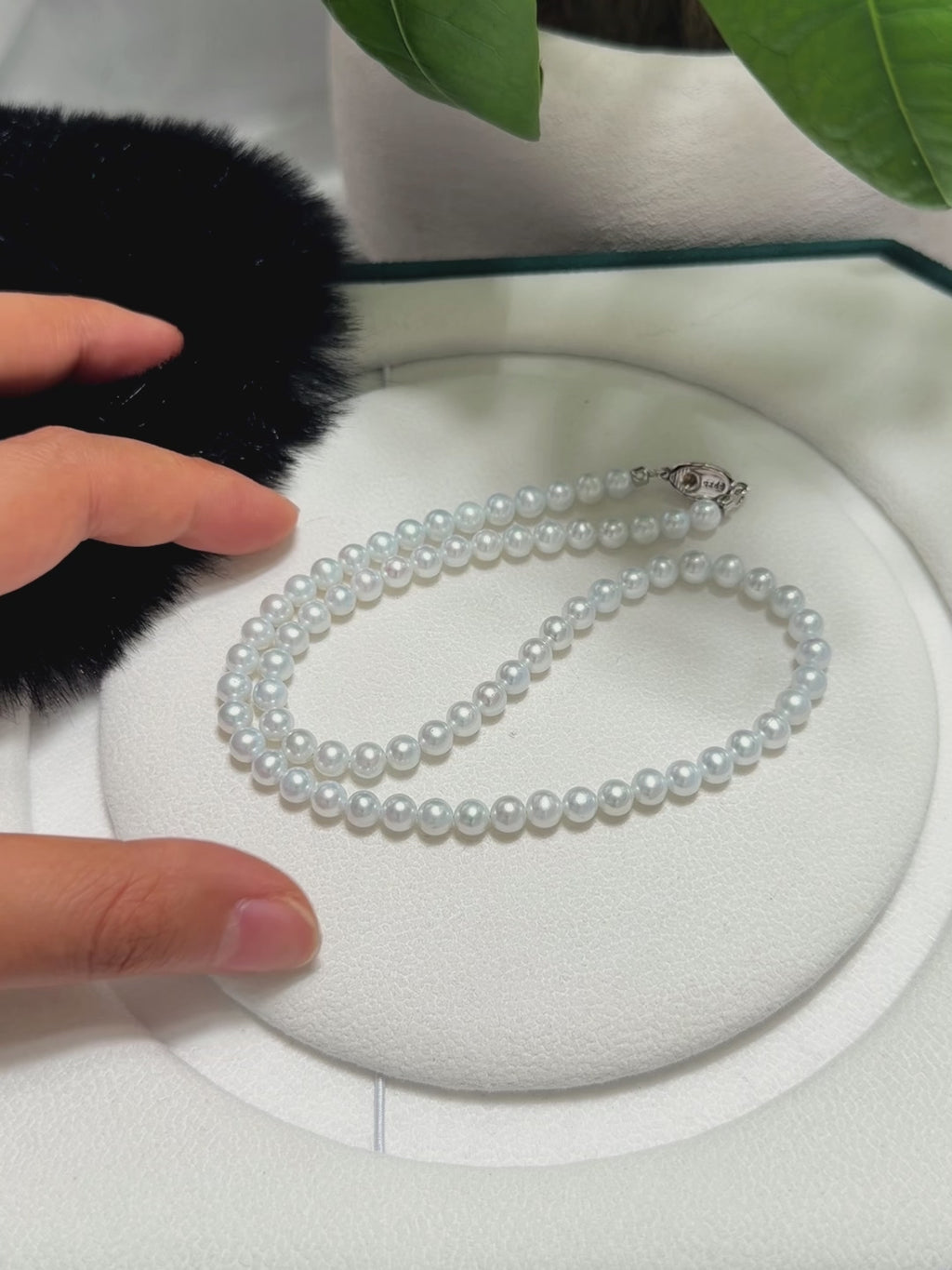 Delicate blue-overtone pearl necklace presented as an elegant jewelry gift.