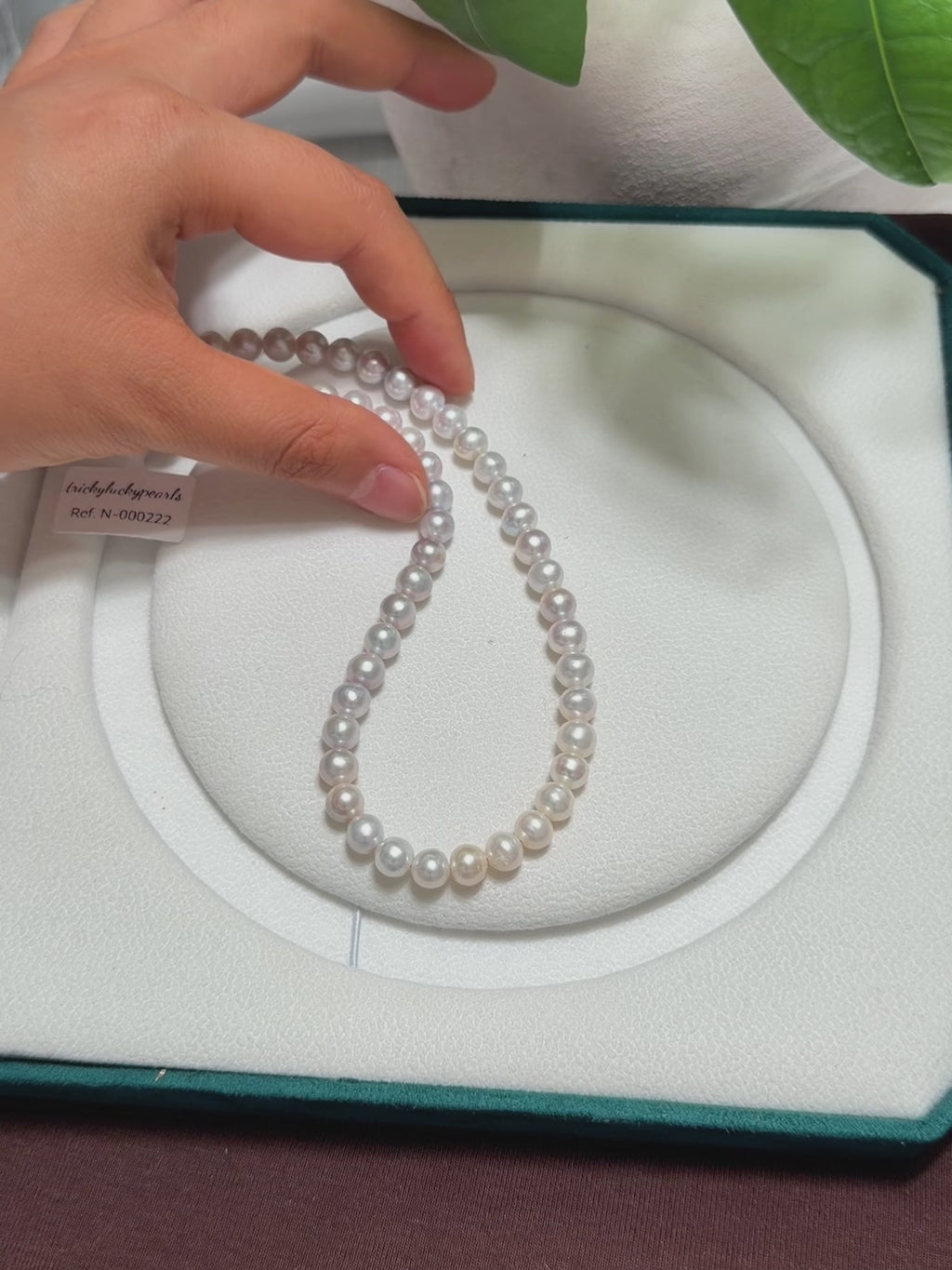 Close-up of blue halo reflections across the freshwater pearls.