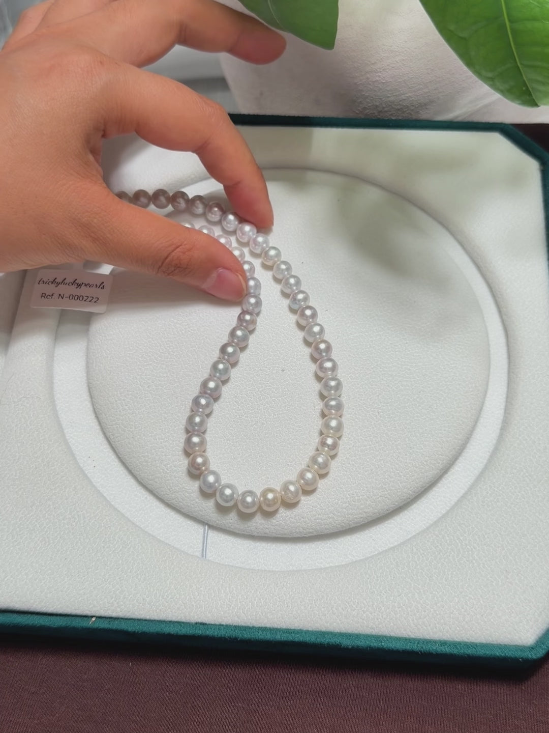 Close-up of blue halo reflections across the freshwater pearls.