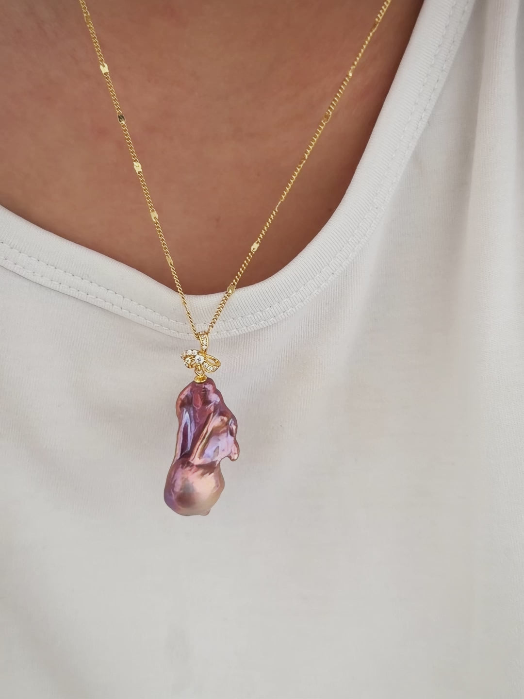 Artistic one-of-a-kind freshwater pearl jewelry featuring multicolor baroque freshwater pearl pendant with sculptural iris flower in sterling silver.