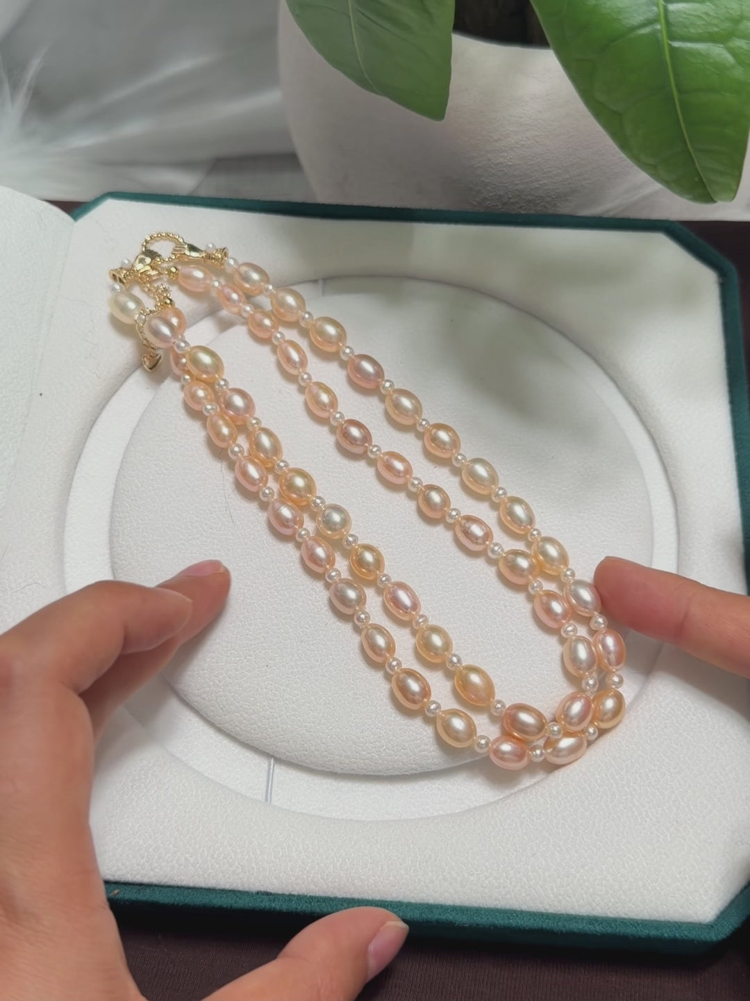 Natural freshwater pearl necklace presented as a jewelry gift.
Versatile long pearl necklace suitable for adding a centre pendant.